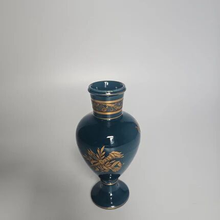 Small turquoise blue and gold porcelain vase with elegant floral patterns.