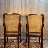 Paire de larges fauteuils cannés d'époque Art Nouveau