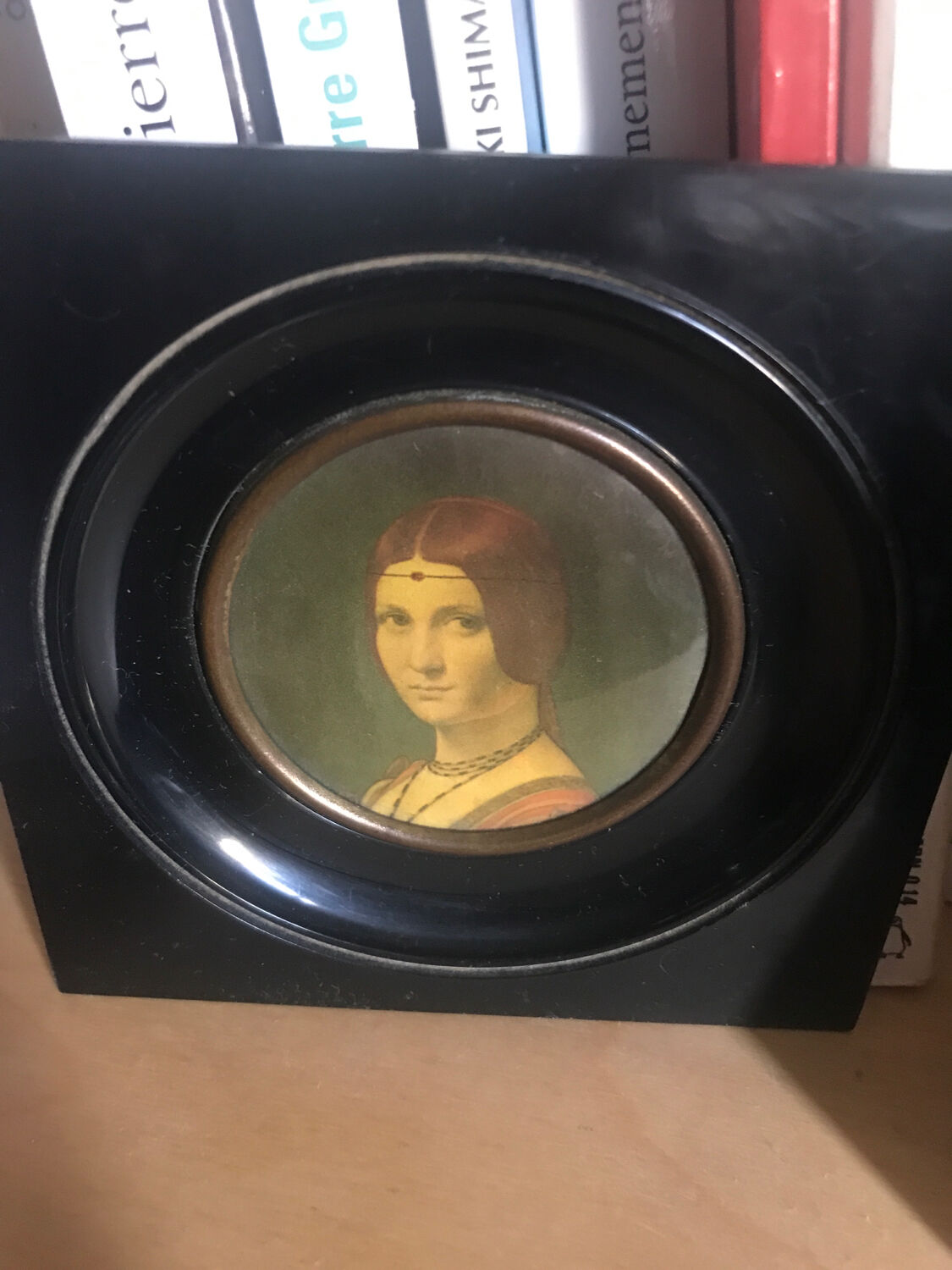 Two vintage round frame portraits