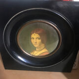 Two vintage round frame portraits