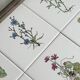 Old wooden plateau with floral tiles