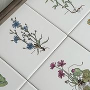 Old wooden plateau with floral tiles