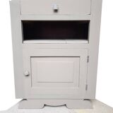 Wooden bedside drawer and a door