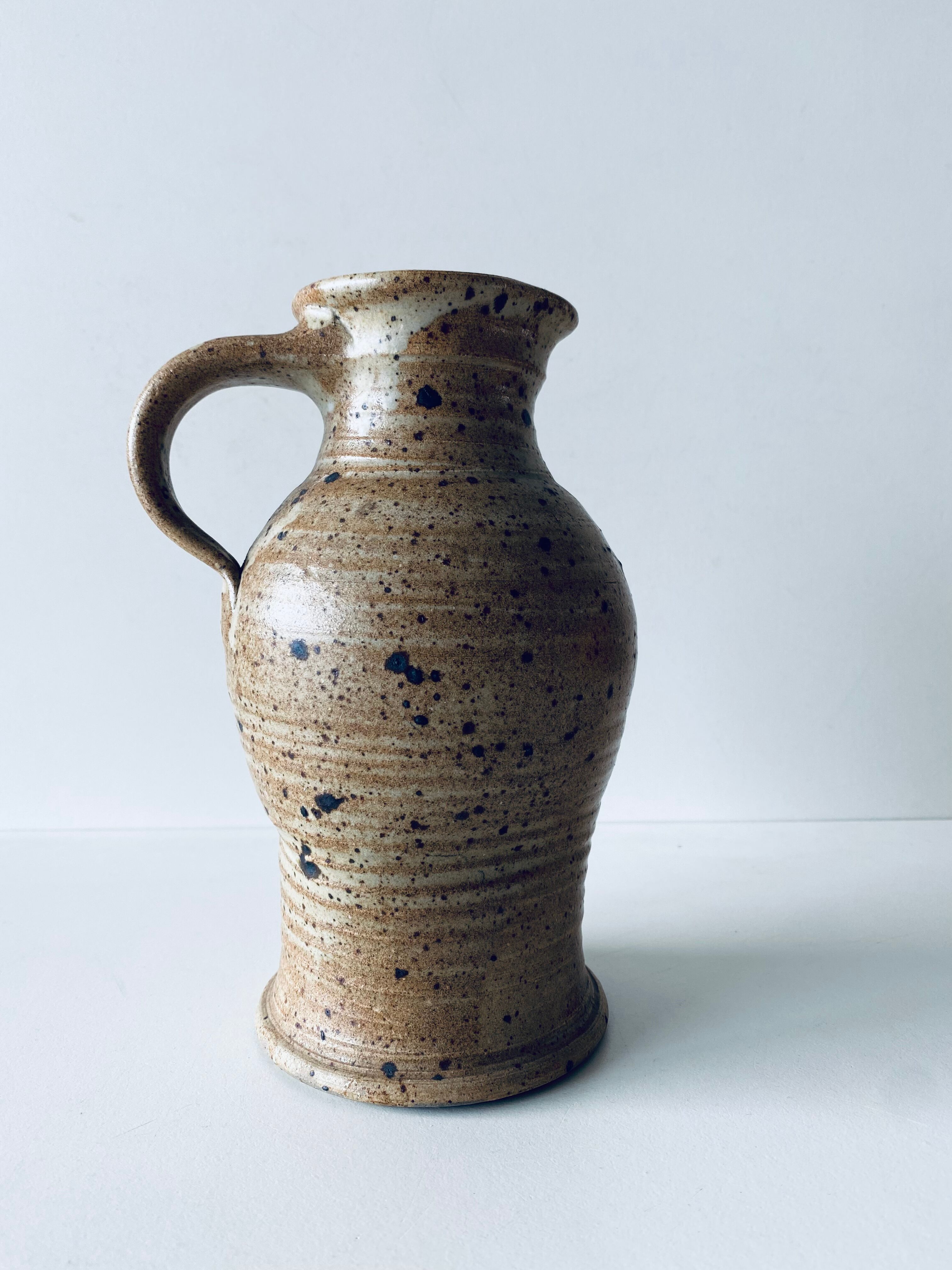 Pitcher in sandstone pyrity signed