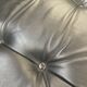 Pair of black leather armchairs