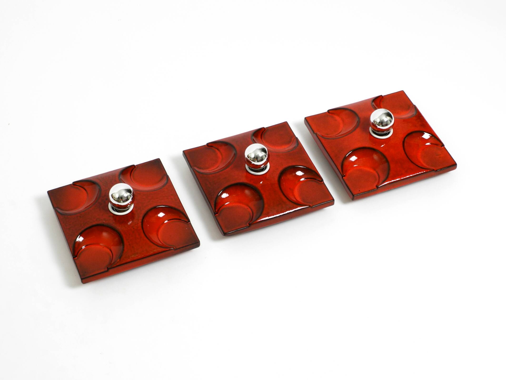 Three beautiful original 1970s Space Age red ceramic wall lamps