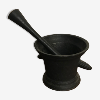 Old cast iron mortar with pestle