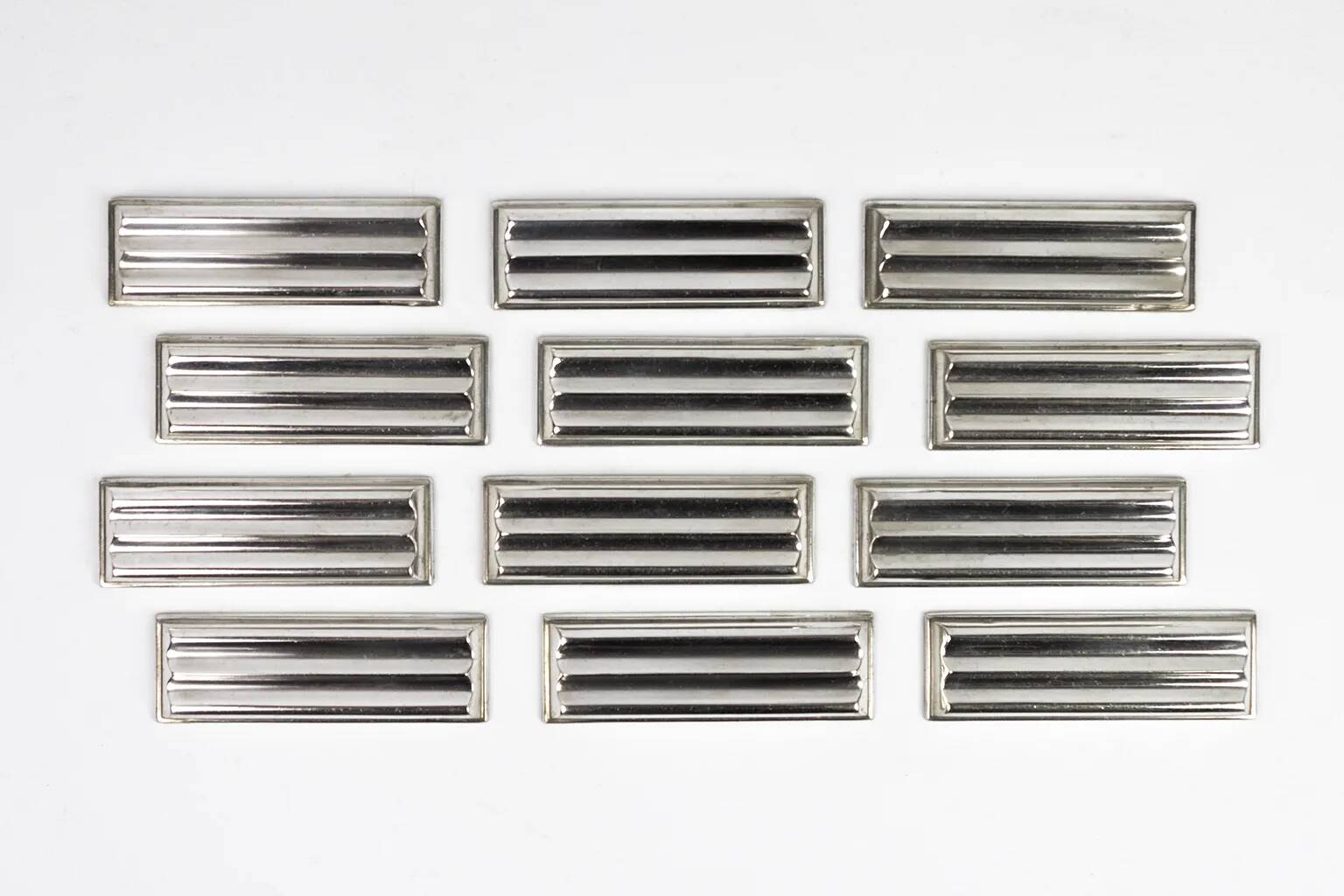 Christofle — 12 “Ondulations” knife rests by Luc Lanel, silver-plated metal