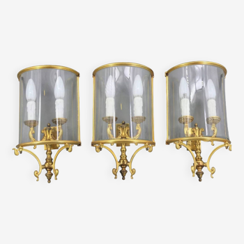 Set of three half-moon wall lights in gilded bronze & curved glass