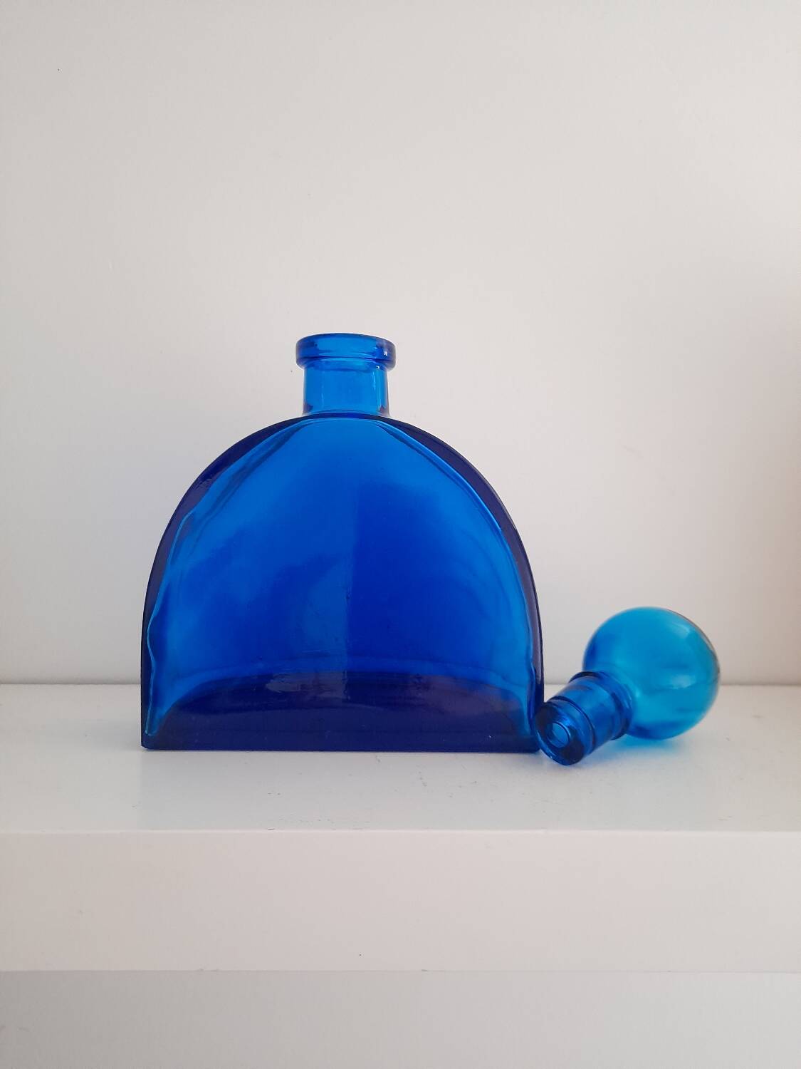 Blue pressed glass half circle carafe