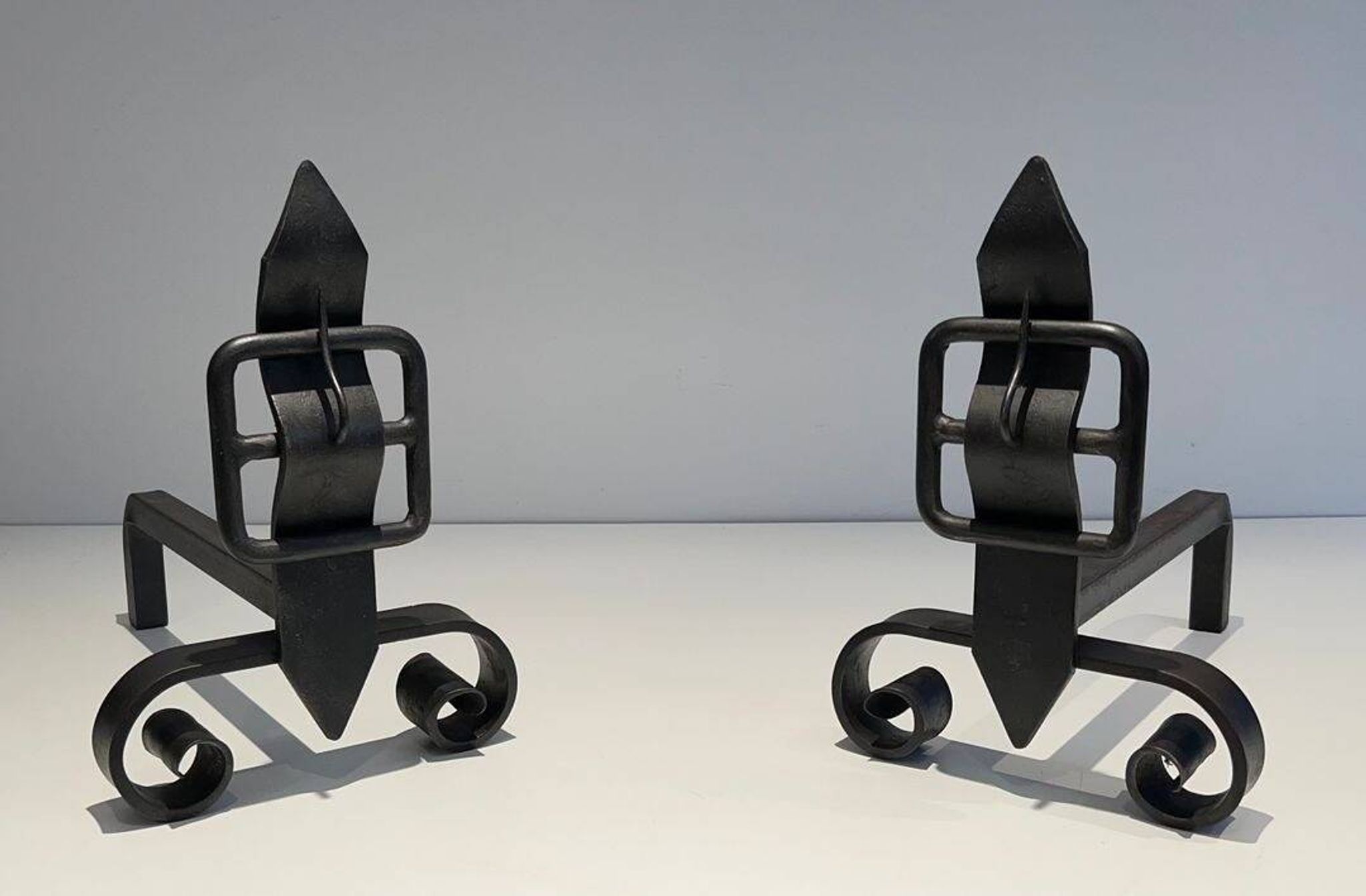 Pair of Wrought Iron Andirons with Obelisk and Belt Motifs