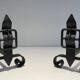 Pair of Wrought Iron Andirons with Obelisk and Belt Motifs