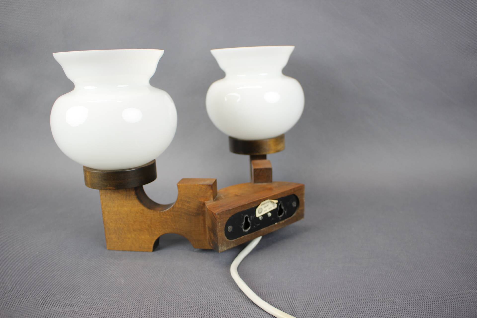 Czechoslovak wall lamp from the 1960s with Valasske Mezirici glass and a wooden base.