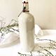 Old light gray enamelled stoneware hot water bottle