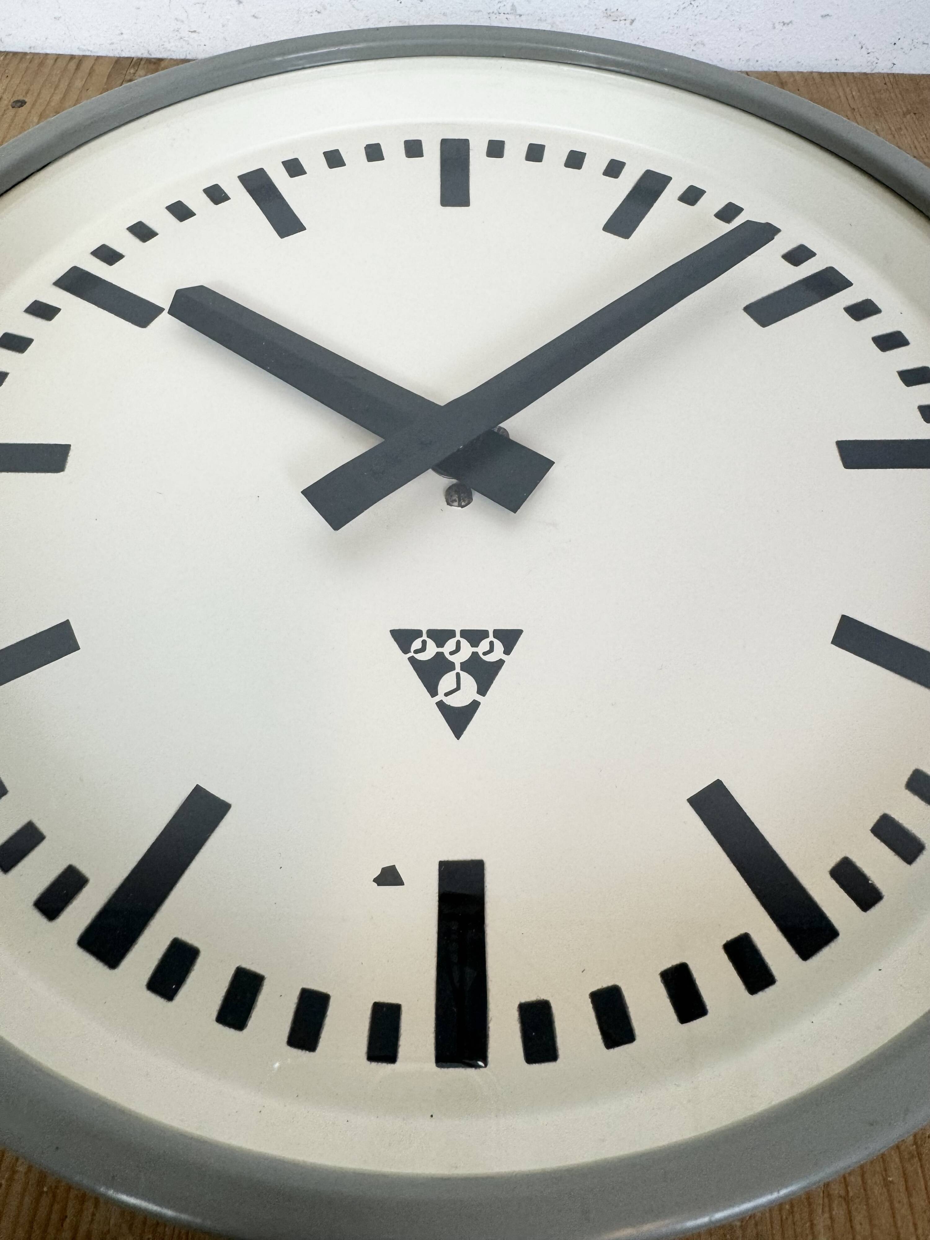 Industrial grey factory wall clock from pragotron, 1960s