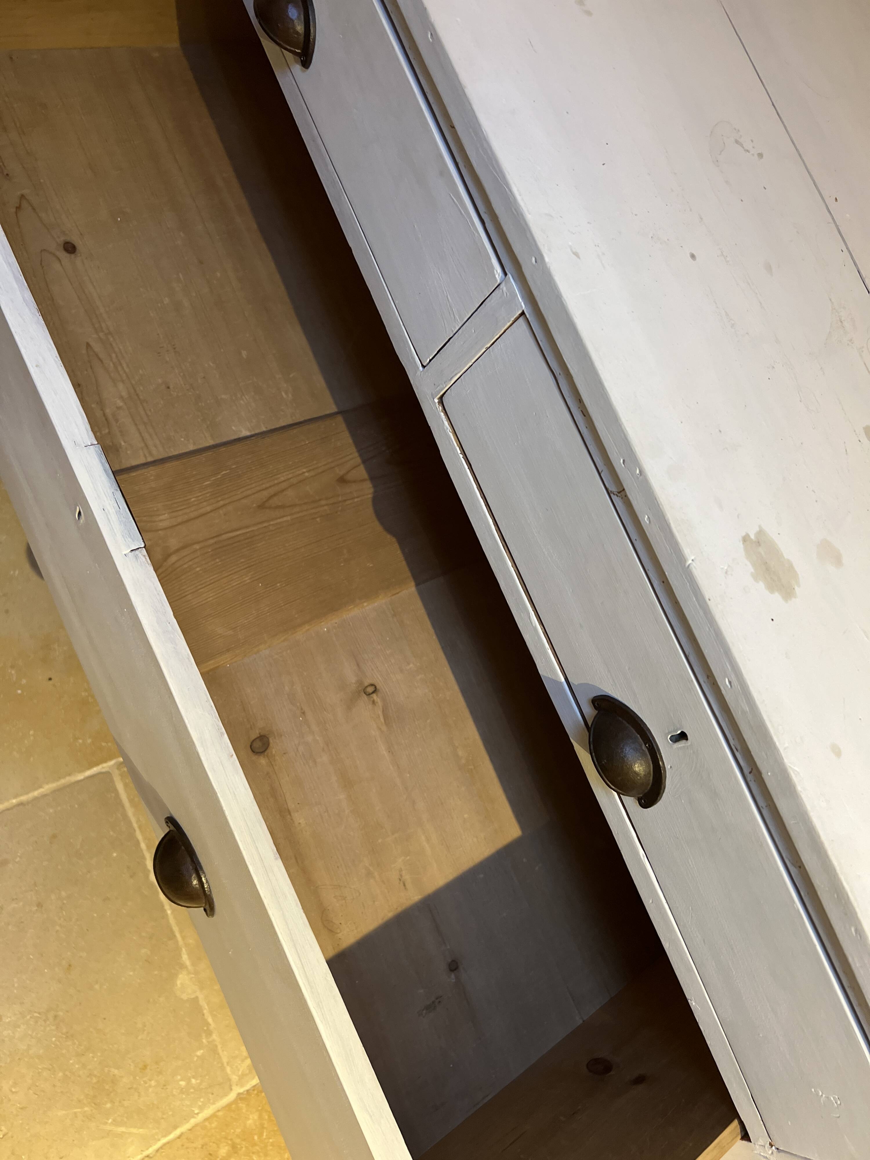 Sturdy antique sideboard with solid wood and drawers.