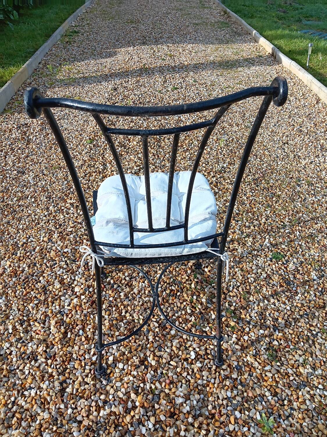 Wrought iron chairs with cushions
