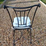 Wrought iron chairs with cushions