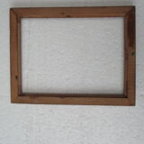 Wooden frame decorated with ribbon and flowers