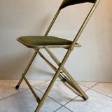 Velvet folding chair with gold metal.