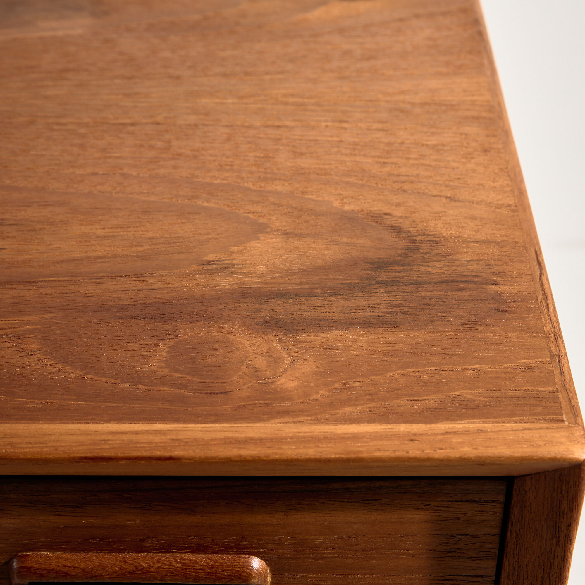 Restored teak chest of drawers with seven drawers.