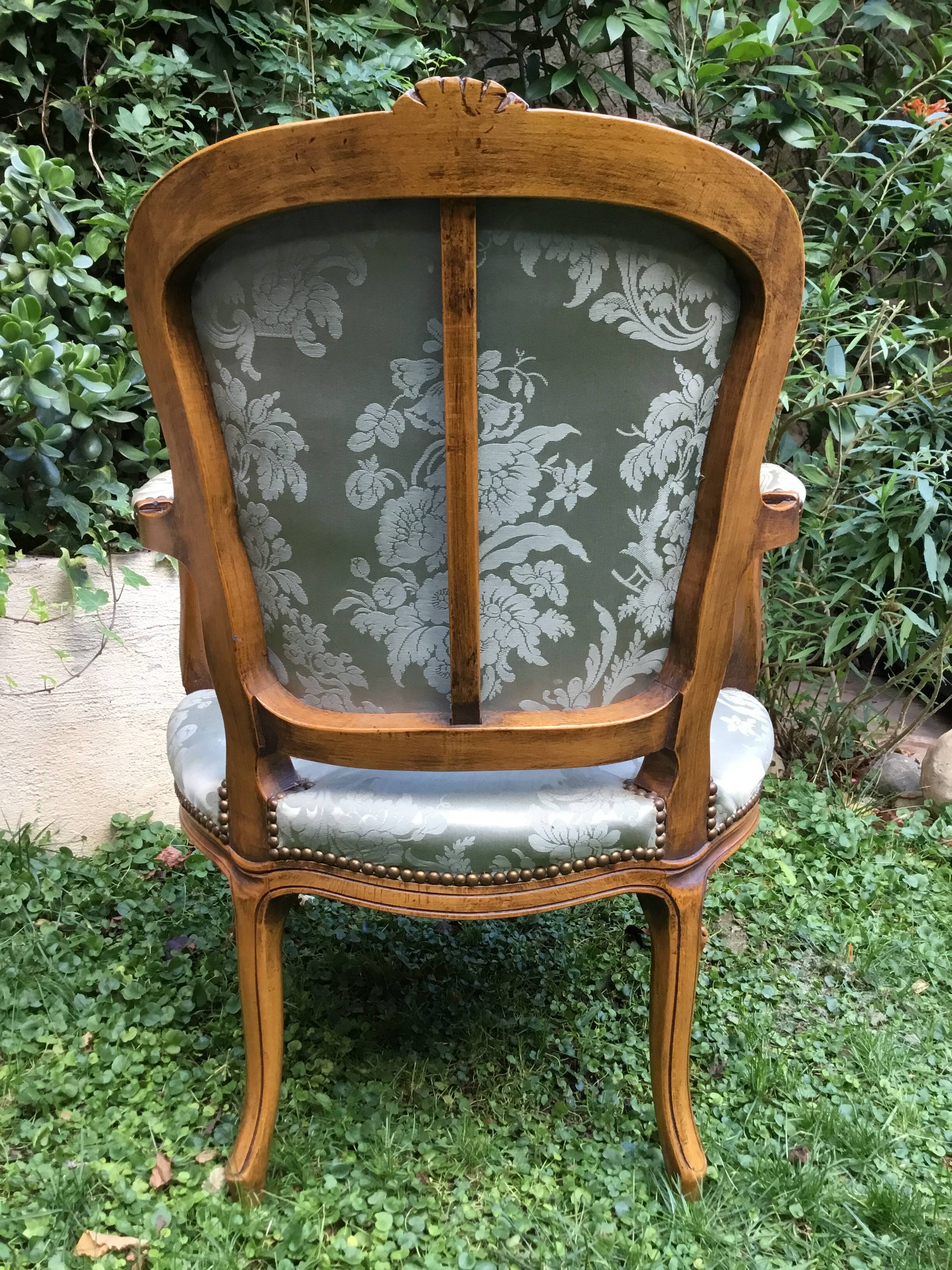 Pair of Louis XV style armchairs in moulded and carved beech.