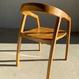 Natural wood chair with wraparound back