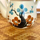 Vintage teapot in stoneware and wicker