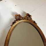 Miroir médaillon en bois doré - 43x24cm