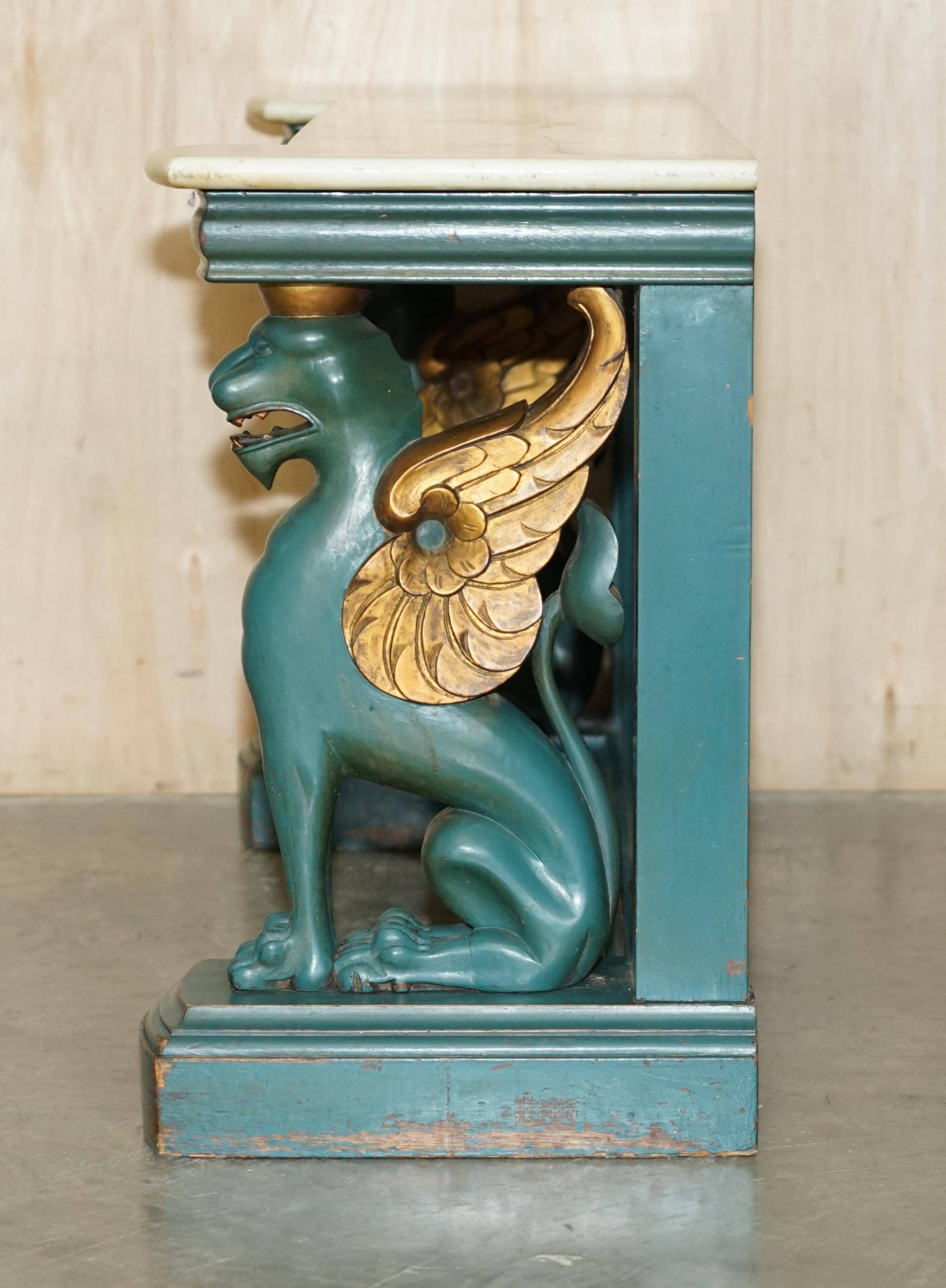 Antique hand-carved console circa 1880 with a marble top.
