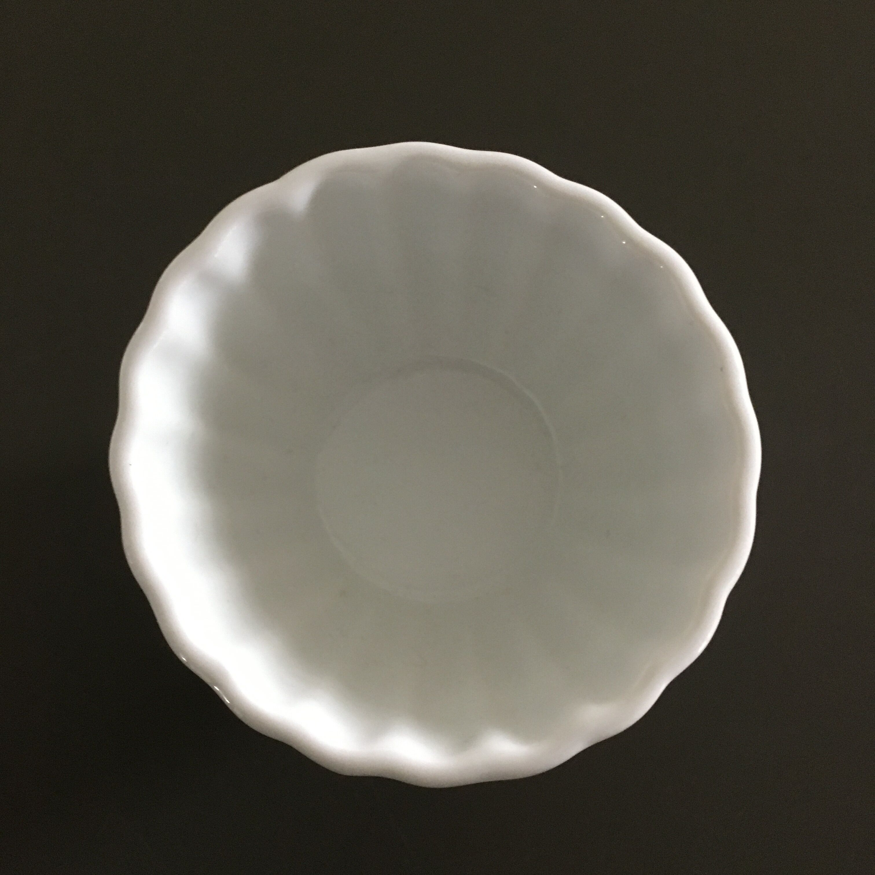 Scalloped porcelain bowl