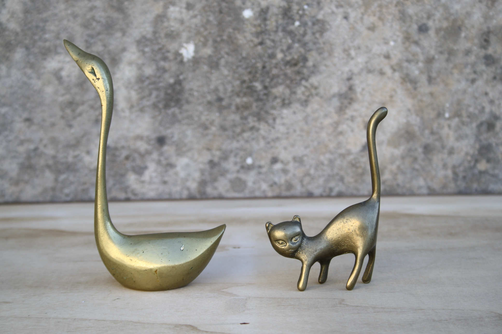 Cat and brass swan