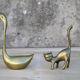 Cat and brass swan
