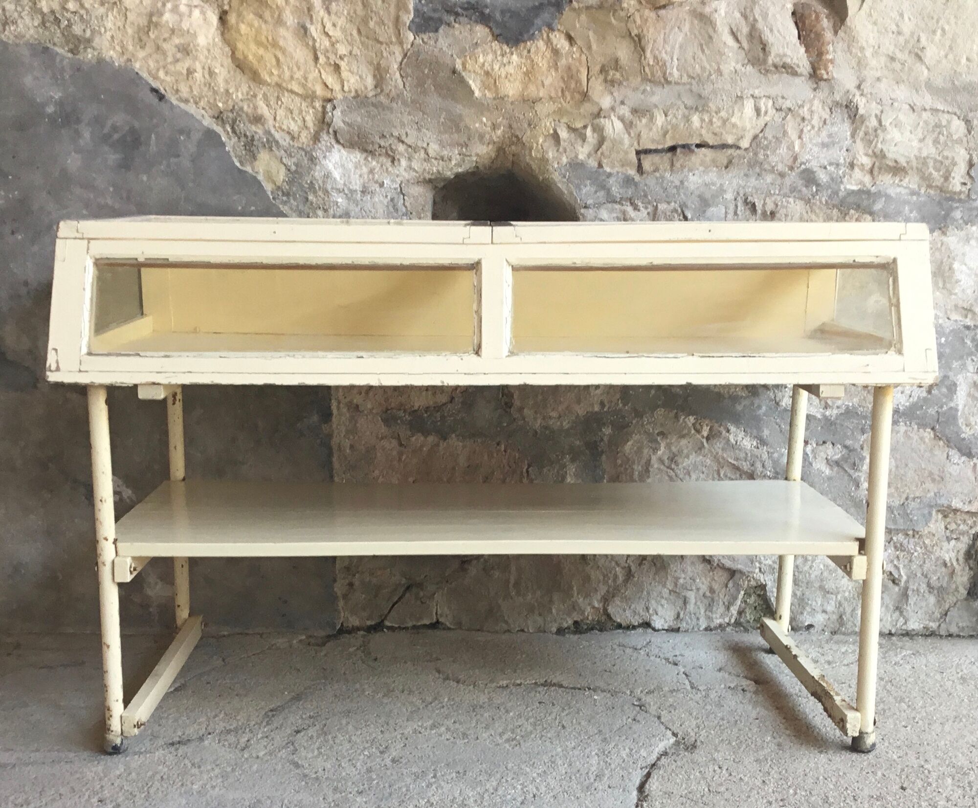 Old showcase on tubular metal feet - early twentieth century