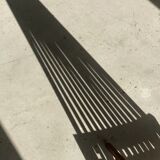 Foldable designer armchair in wooden slats