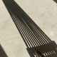 Foldable designer armchair in wooden slats