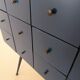 Vintage workshop furniture with 15 blue drawers.