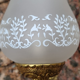 Pair of bronze wall lamps and frosted glass globe, early twentieth century.