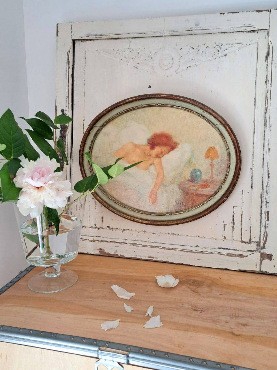 Ancient oval painting of a sleeping woman in oil on wood panel.