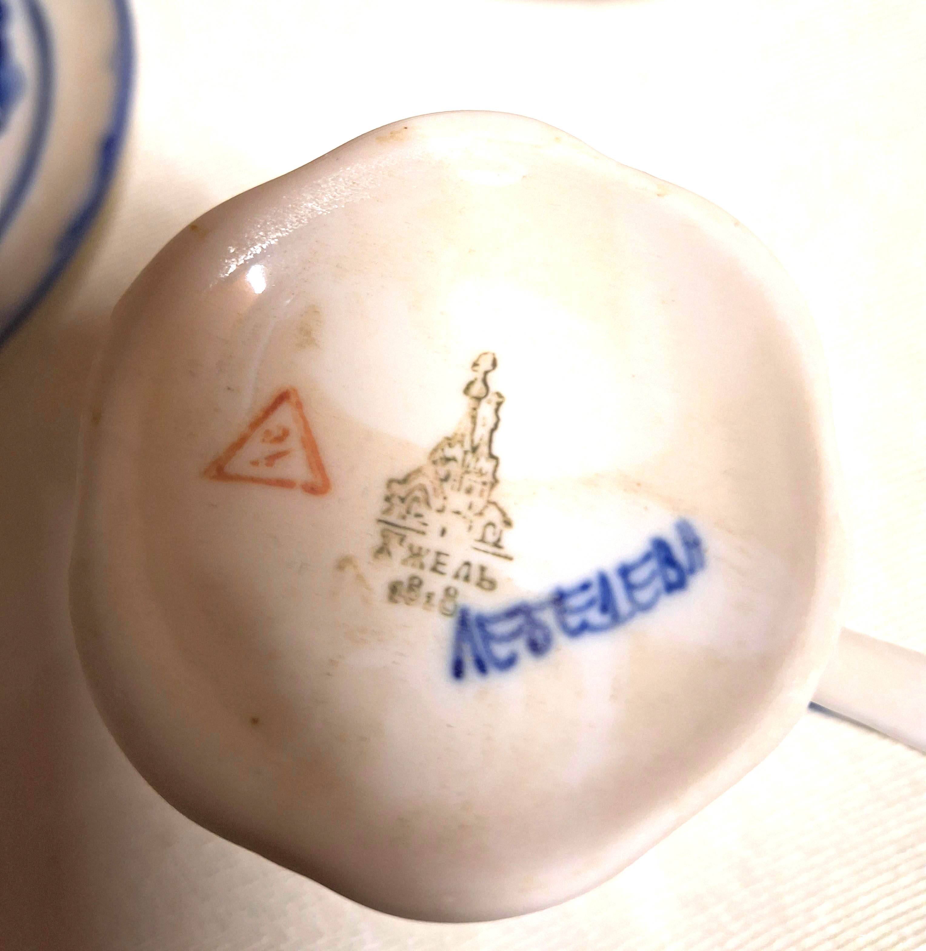 Three cups and two saucers made of Gzhel porcelain.