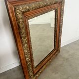 Old mirror in oak and gilded wood early 20th century beveled glass
