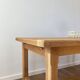 Solid oak farmhouse table with extensions.