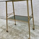 Vintage 1970s glass and gold rolling console table.