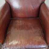 Sheepskin armchair correctly finished with decorative nails and in good condition