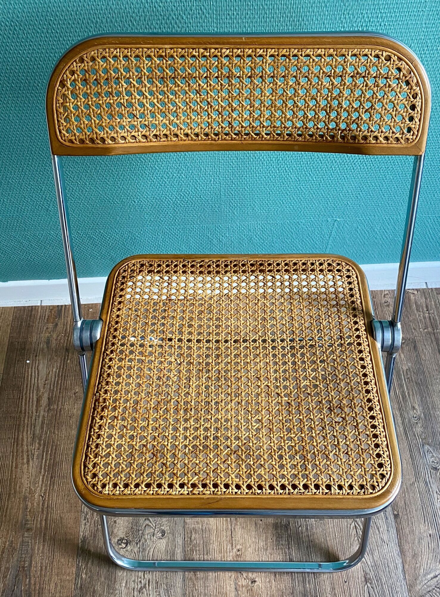 Wooden and caning folding chair "Plia" by G. Piretti for Castelli editions