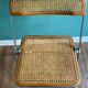 Wooden and caning folding chair "Plia" by G. Piretti for Castelli editions