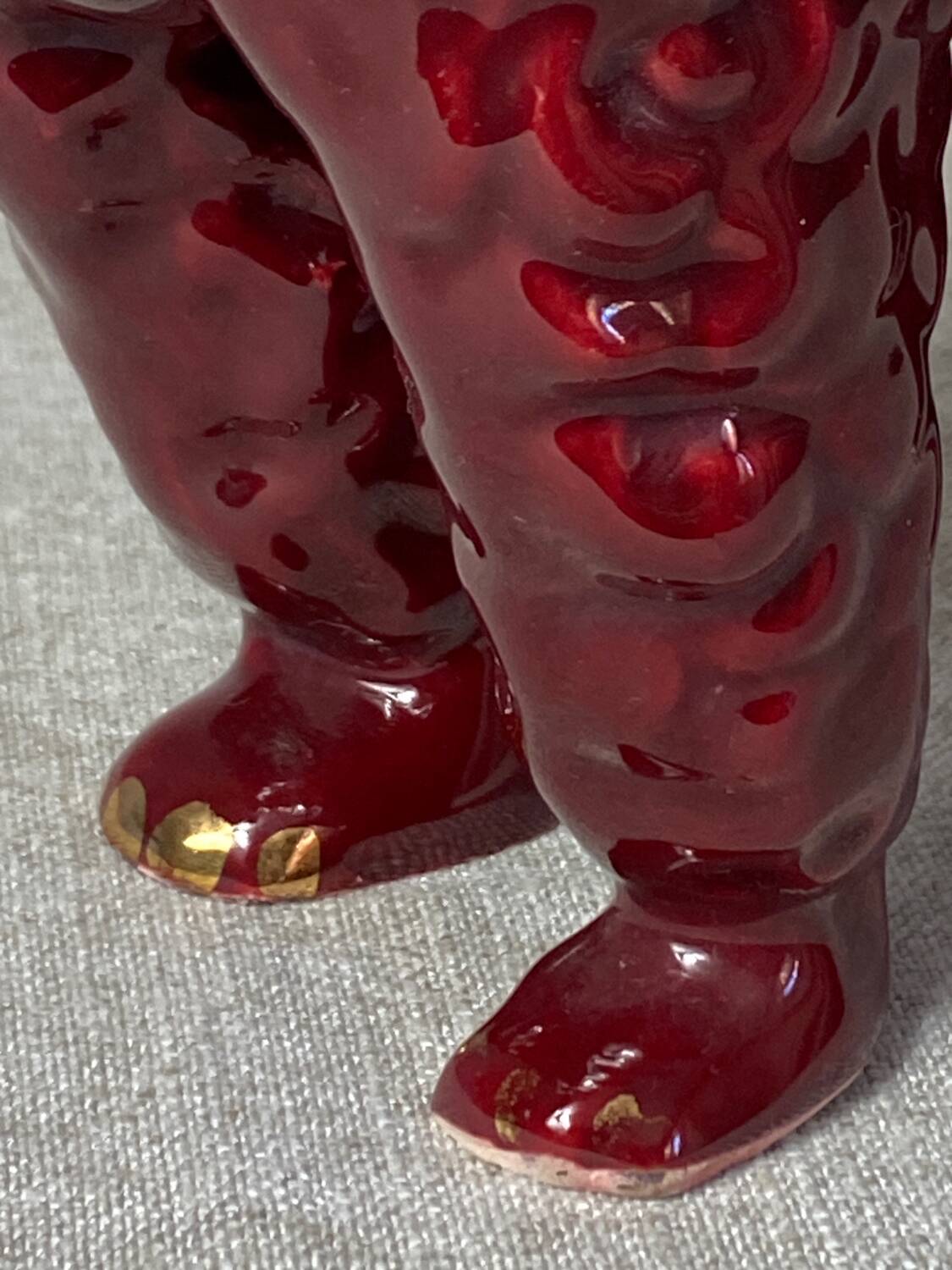 Burgundy and gold ceramic dog