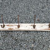 antique coat rack with 4 cast iron hooks