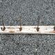 antique coat rack with 4 cast iron hooks