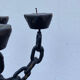 Brutalist iron and wood chain candle holder from the 1970s